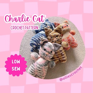May include: A collection of handmade crochet cat toys in various colors, including blue, brown, pink, and orange. The toys are arranged on a light gray surface. The text "Charlie Cat CROCHET PATTERN" is displayed in pink, along with "LOW SEW".