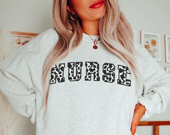 Cow Print Nurse Sweatshirt, Womens Cow Sweatshirt, Cow Print Sweatshirt, Cow Printed Sweater, Nurse Apparel, Animal Print Sweatshirt