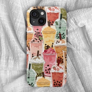 May include: A phone case featuring a colorful pattern of various bubble tea drinks. The design includes a variety of flavors, with different colors and toppings, such as strawberries and boba pearls. The case has a black camera lens.