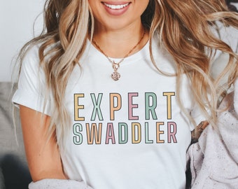 Expert Swaddler Shirt, NICU Nurse Shirt, OB Nurse Shirt, Postpartum Nurse Shirt, Mother Baby Nurse Shirt, Labor and Delivery Nurse Shirt