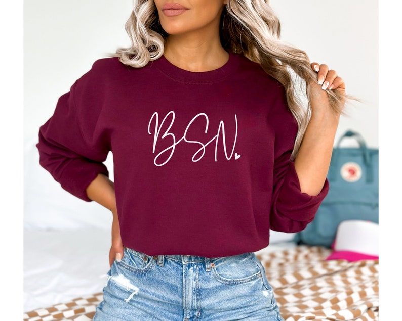 May include: A maroon sweatshirt with the text "BSN" in white script lettering.