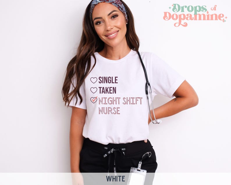 May include: White t-shirt with a pink heart graphic and the text "SINGLE, TAKEN, NIGHT SHIFT NURSE" with a checkmark next to the last option.