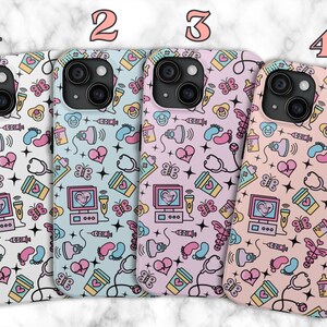 May include: Four different phone cases with a baby-themed pattern. The cases are white, light blue, pink, and light pink. The pattern includes butterflies, hearts, baby bottles, pacifiers, and stethoscopes.