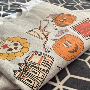 Halloween Nurse Sweatshirt, Medical Halloween Sweatshirt, ER Nurse Crewneck Sweatshirt, Telemetry Nurse Sweatshirt, Emergency Squad Sweater