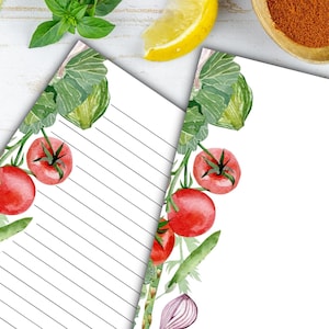May include: Two printable sheets of lined paper with a watercolor border of tomatoes, onions, and green leaves. The border is on the left side of each sheet.