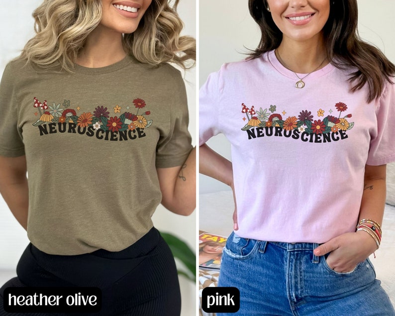 May include: Two women's t-shirts with a floral design and the text "Neuroscience". The shirt on the left is heather olive and the shirt on the right is pink.