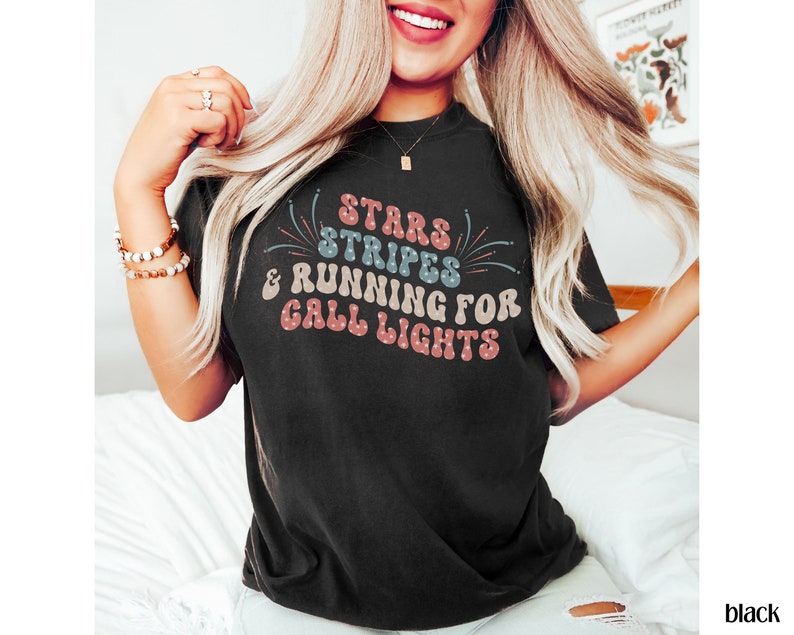May include: A black t-shirt with a retro-style graphic that says "Stars & Stripes & Running for Call Lights".