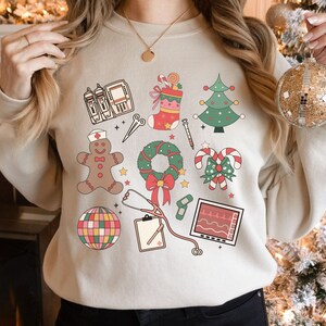 Christmas Nurse Sweatshirt, Medical Christmas Sweatshirt, ER Nurse Crewneck Sweatshirt, Telemetry Nurse Sweatshirt, Emergency Squad Sweater Sand