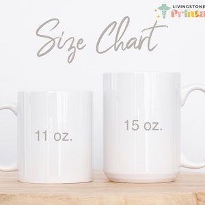 May include: Two white ceramic mugs, one 11 oz and one 15 oz, on a wooden surface. The mugs are blank and ready for personalisation.
