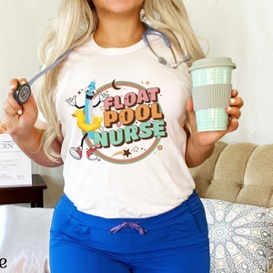May include: White t-shirt with a cartoon illustration of a pool float and the text "Float Pool Nurse".
