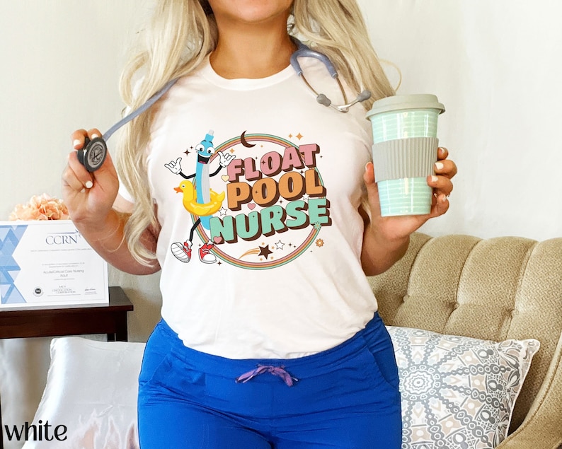 May include: White t-shirt with a cartoon illustration of a pool float and the text "Float Pool Nurse".