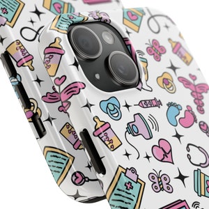 May include: White iPhone case with a colorful pattern of baby-related icons, including pacifiers, bottles, footprints, and a stethoscope. The case has a black camera cutout.