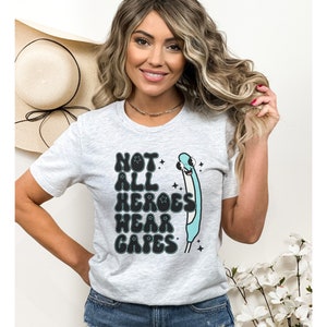 May include: A gray t-shirt with a graphic of a stethoscope and the text "Not all heroes wear capes".