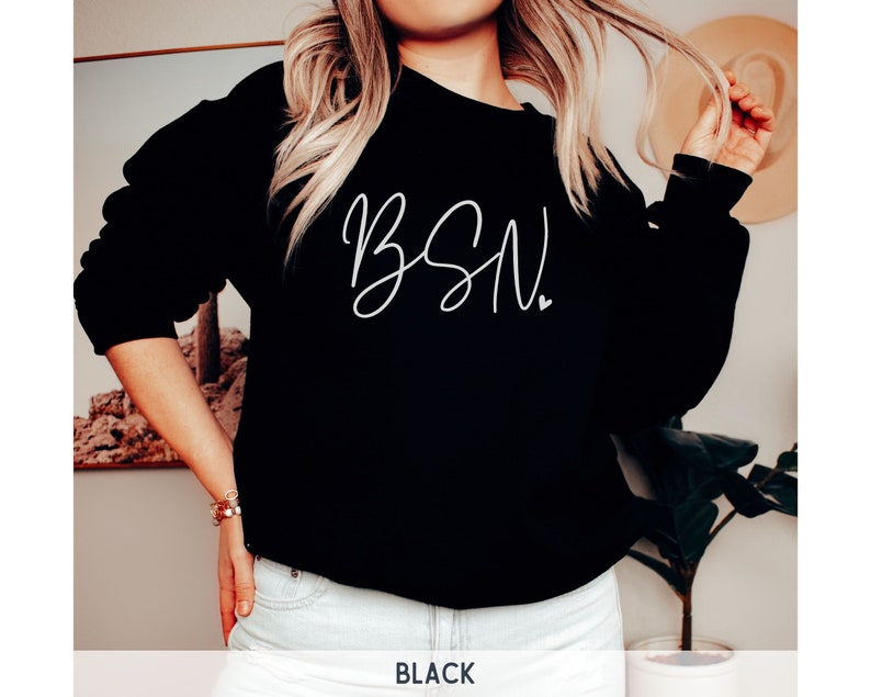 May include: Black sweatshirt with white cursive text that says "BSN".