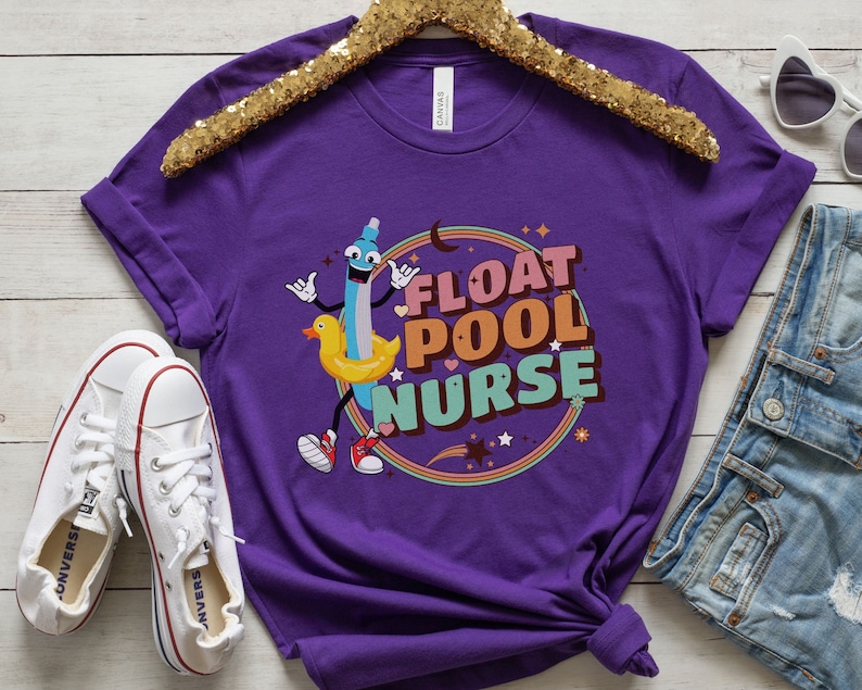 May include: Purple t-shirt featuring a cartoon illustration of a pool float and the text "Float Pool Nurse".