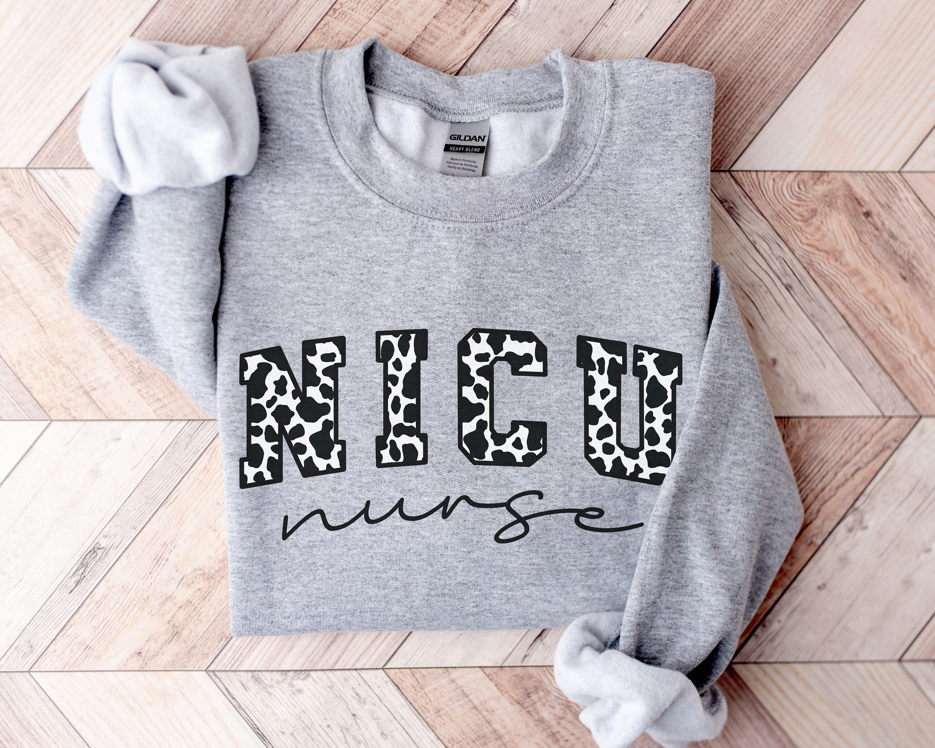 nike cow print sweater