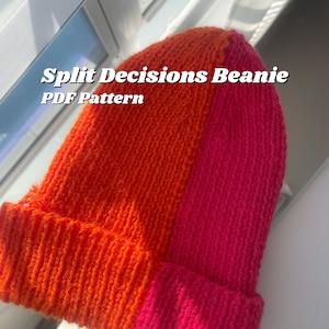 May include: A split-colour beanie knitting pattern in orange and pink. The pattern is called "Split Decisions Beanie" and is available as a PDF download.