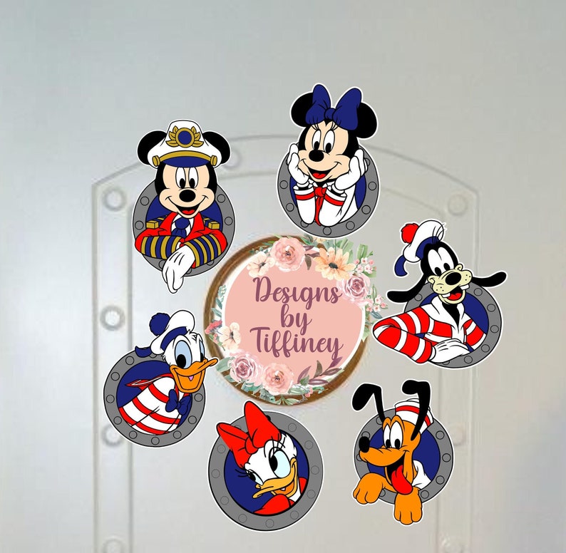 May include: Six colourful cartoon character stickers with a nautical theme. Each character is wearing a sailor hat and a red and white striped shirt. The stickers are arranged in a circle around a pink and white floral wreath with the text "Designs by Tiffiney".