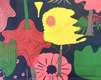 May include: A dark blue fabric with a repeating pattern of stylized trees. The trees have pink, yellow, and green leaves and are outlined in black. The fabric has a whimsical and modern design.