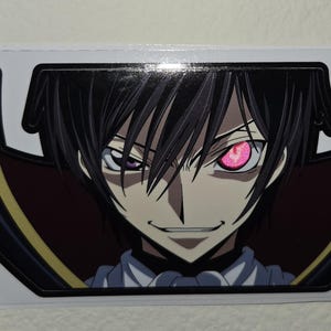 May include: A sticker featuring an anime character with black hair and a confident smirk. The character has one pink eye and one purple eye. The sticker has a black and gold border.