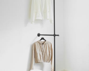 Double wall-mounted clothes rail made of black metal, industrial wall-mounted wardrobe with floor support