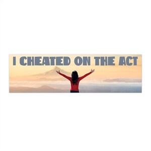 May include: A rectangular sticker with the text "I CHEATED ON THE ACT" in gray letters. The sticker features a person with arms outstretched against a backdrop of a mountain and a cloudy sky.