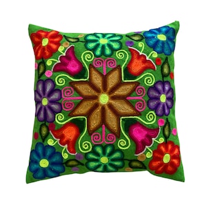 Green Cuzco cushion with a super cheerful and colorful floral motif.