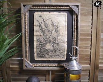 May include: A framed black and white print of a ship being attacked by a giant octopus. The frame is made of wood and has a rope border.