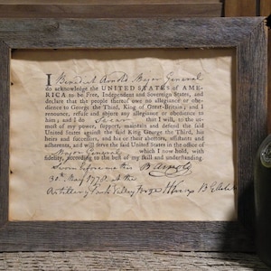May include: A framed document with a handwritten oath of allegiance to the United States of America, signed by Benedict Arnold, Major General, on May 30, 1778, at the Artillery Park Valley Forge.