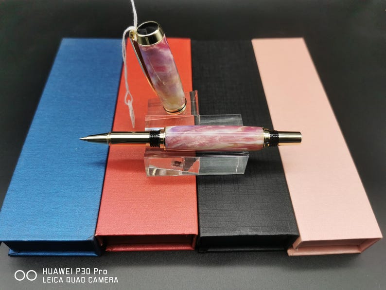 May include: A set of three ceramic mugs with a speckled, matte finish. The mugs are in shades of cream, light gray, and dark gray. Each mug has a simple, minimalist design, perfect for coffee or tea.