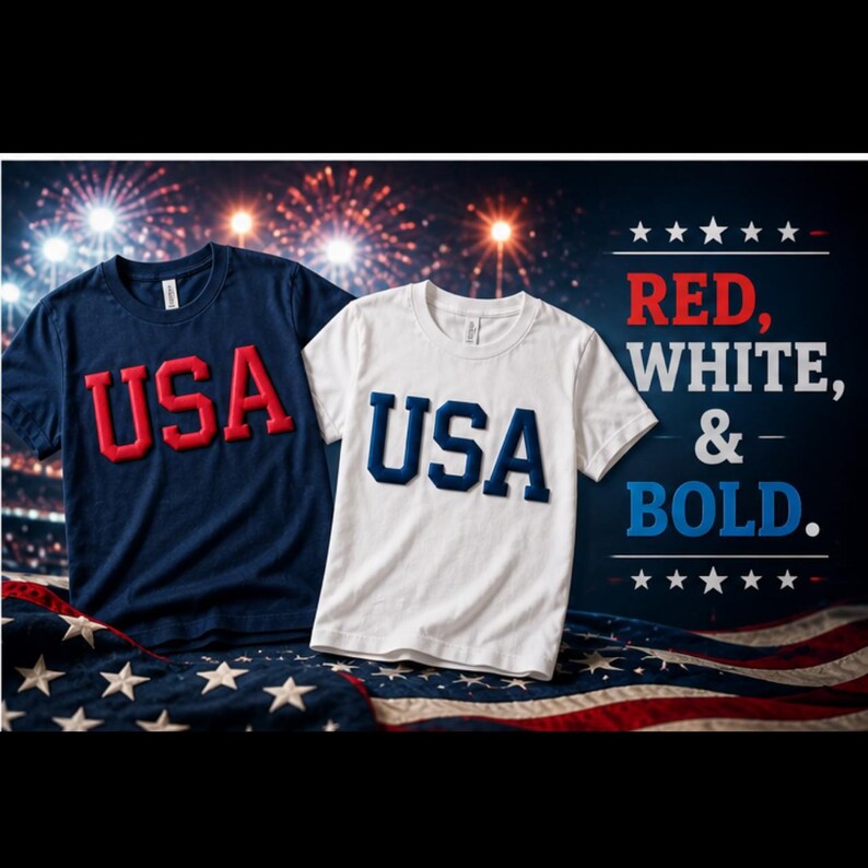 May include: Two t-shirts, one navy blue and one white, each with "USA" in bold letters. The navy shirt has red lettering, while the white shirt has blue lettering. The background features fireworks and an American flag.