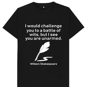 May include: Black t-shirt with white text that reads "I would challenge you to a battle of wits, but I see you are unarmed."  The text is attributed to William Shakespeare and is accompanied by a white quill pen illustration.