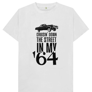 May include: White t-shirt with a black silhouette of a classic car and the text "Cruisin' Down The Street In My '64"