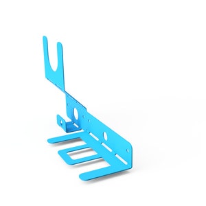 May include: A light blue metal wall mount with four hooks and a single hook on the top. The hooks are designed to hold items like towels or robes.