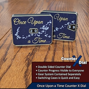 May include: Two black and gold counter dials with a starry night design. The dials read "Once Upon a Time..." and "Upon a Time..." with the numbers 20 and 99 visible. The dials are part of a counter system with a gear system contained separately. The text "Counter X Dial" is visible below the dials.
