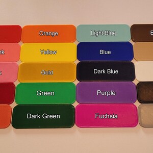 May include: A collection of rectangular color swatches, each labeled with a color name. Colors include red, orange, yellow, green, blue, purple, and more. The swatches are arranged in rows and columns, providing a visual color palette.