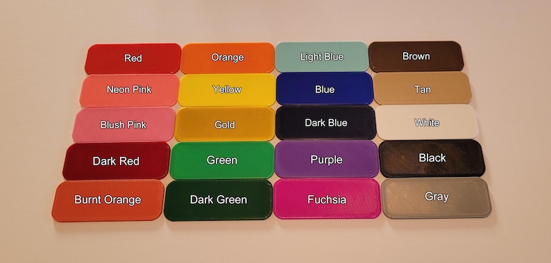 May include: A collection of rectangular color swatches, each labeled with a color name. Colors include red, orange, yellow, green, blue, purple, and more. The swatches are arranged in rows and columns, providing a visual color palette.