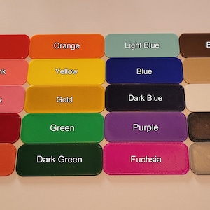 May include: A color chart with 20 different color swatches. The swatches are arranged in four rows of five. The colors are: red, orange, light blue, brown, neon pink, yellow, blue, tan, blush pink, gold, dark blue, white, dark red, green, purple, black, burnt orange, dark green, fuchsia, and gray.