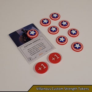 May include: A set of red, white, and blue Captain America themed game tokens. The tokens feature a white star on a blue circle surrounded by a red ring. There are two red tokens with the number "1" in white. The text on the card reads "Captain America" and "When Captain America is played, place a +1 Strength token on Captain America and each other Hero in the targeted player's Domain."
