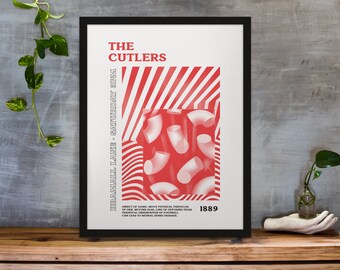 May include: Framed art print with a black border. The print features red and white graphics, including diagonal stripes and abstract shapes. Text on the print reads "THE CUTLERS" and "BRAMALL LANE - SATURDAY 3PM".