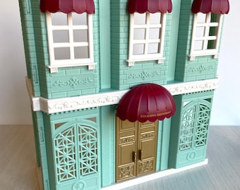 Calico Critters building with Gold door,