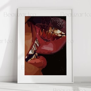 May include: A framed art print featuring a close-up of red lips with gold teeth. The artwork has a dark background and the text "Beauzartco" is visible in the corners.