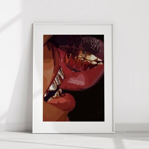 May include: A framed art print featuring a close-up of two sets of lips in a kiss. The lips are a deep red, with gold teeth visible. The artwork is set against a black background.