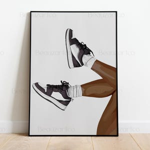 May include: Framed art print featuring a stylized illustration of legs wearing black and white sneakers and white socks. The artwork is set against a white background, with the legs and shoes as the focal point. The sneakers have black laces.