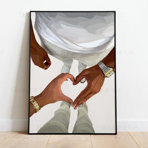 May include: A framed art print featuring a couple's hands forming a heart shape. The artwork depicts two people, with their hands and arms visible, wearing gold and silver watches and bracelets. The figures are dressed in white and gray clothing.