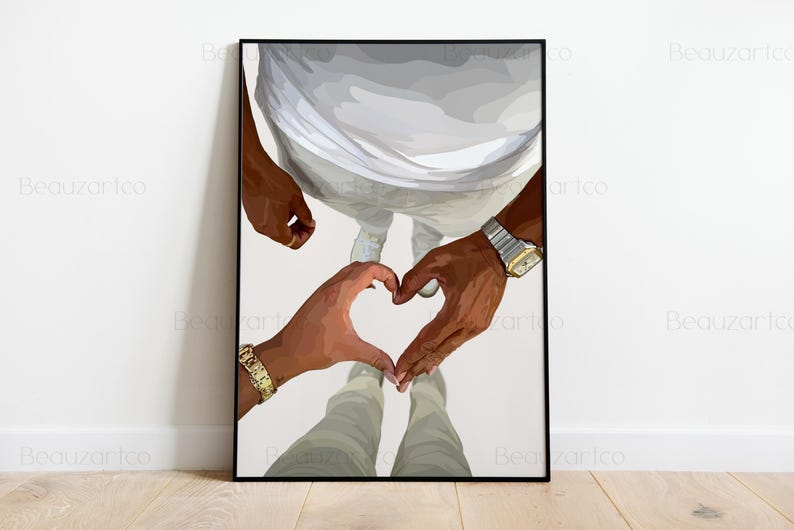 May include: A framed art print featuring a couple's hands forming a heart shape. The artwork depicts two people, with their hands and arms visible, wearing gold and silver watches and bracelets. The figures are dressed in white and gray clothing.