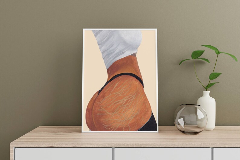 May include: A framed illustration of a person's torso and hips, with a white shirt and black underwear. The skin is depicted with detailed lines and a warm brown tone.