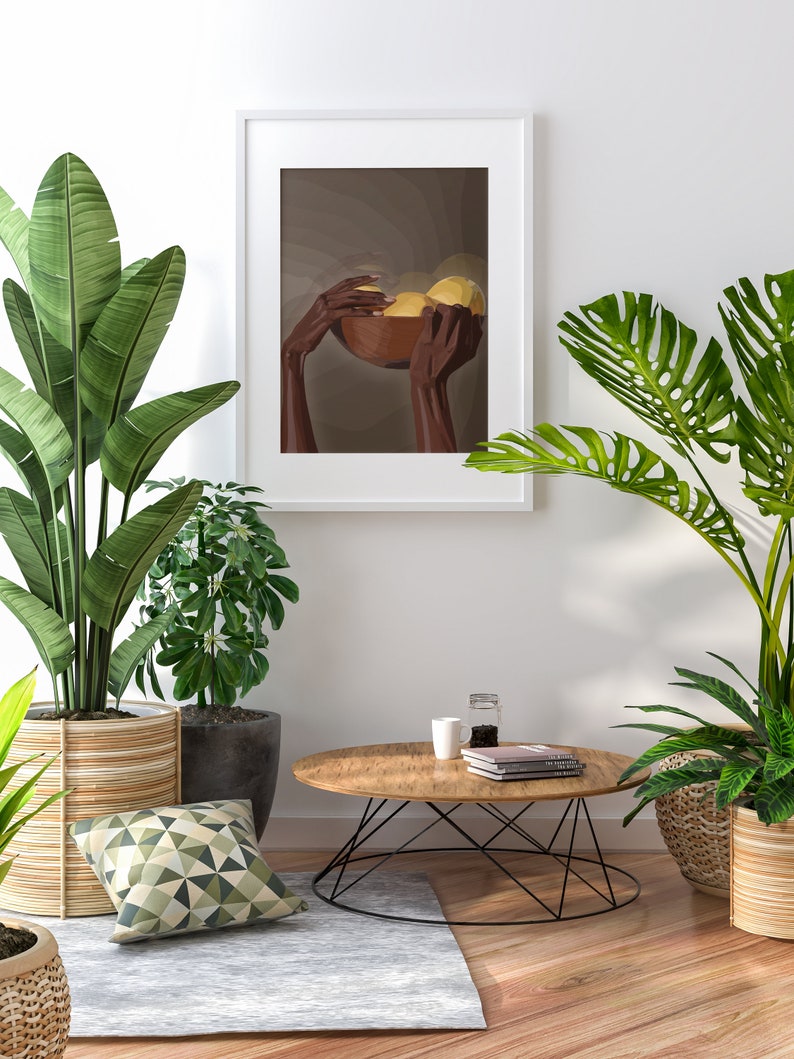 May include: A framed illustration of two hands holding a bowl of fruit. The hands are brown and the fruit is yellow. The background is a muted brown color. The frame is white and the illustration is in a minimalist style.