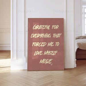 May include: A pink and gold motivational quote poster with the text "Grateful for everything that forced me to love myself more".