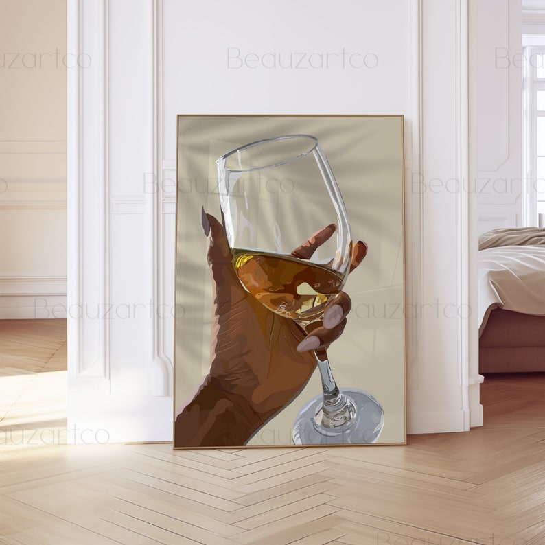 May include: A hand holding a glass of wine. The glass is clear and the wine is a light amber color. The hand is brown and has long, manicured nails.